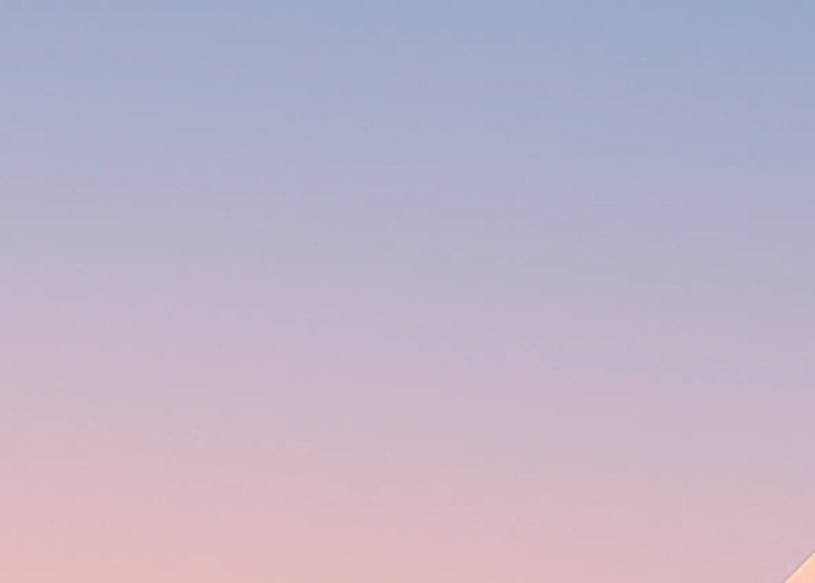 Soft blue-to-pink gradient background.