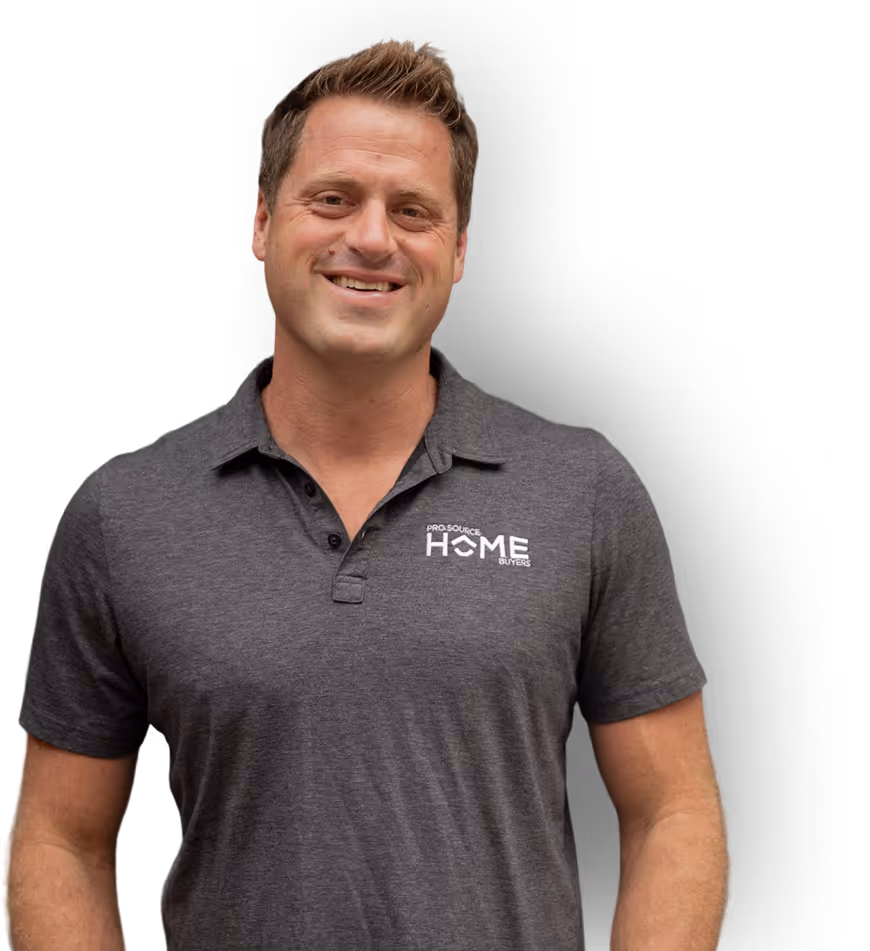 Smiling man in a gray Pro Source Home Buyers polo shirt on a transparent background.