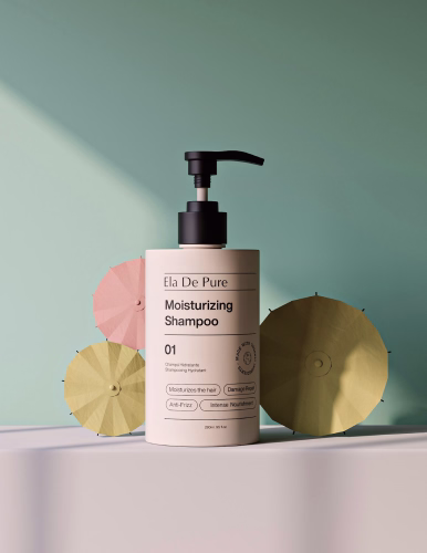 Bottle of Ela De Pure moisturizing shampoo with decorative pastel paper umbrellas on a soft green background.