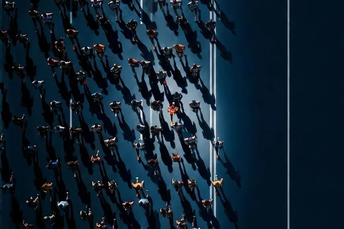Aerial view of a dense crowd of runners, representing the scale at which Google's machine learning operates