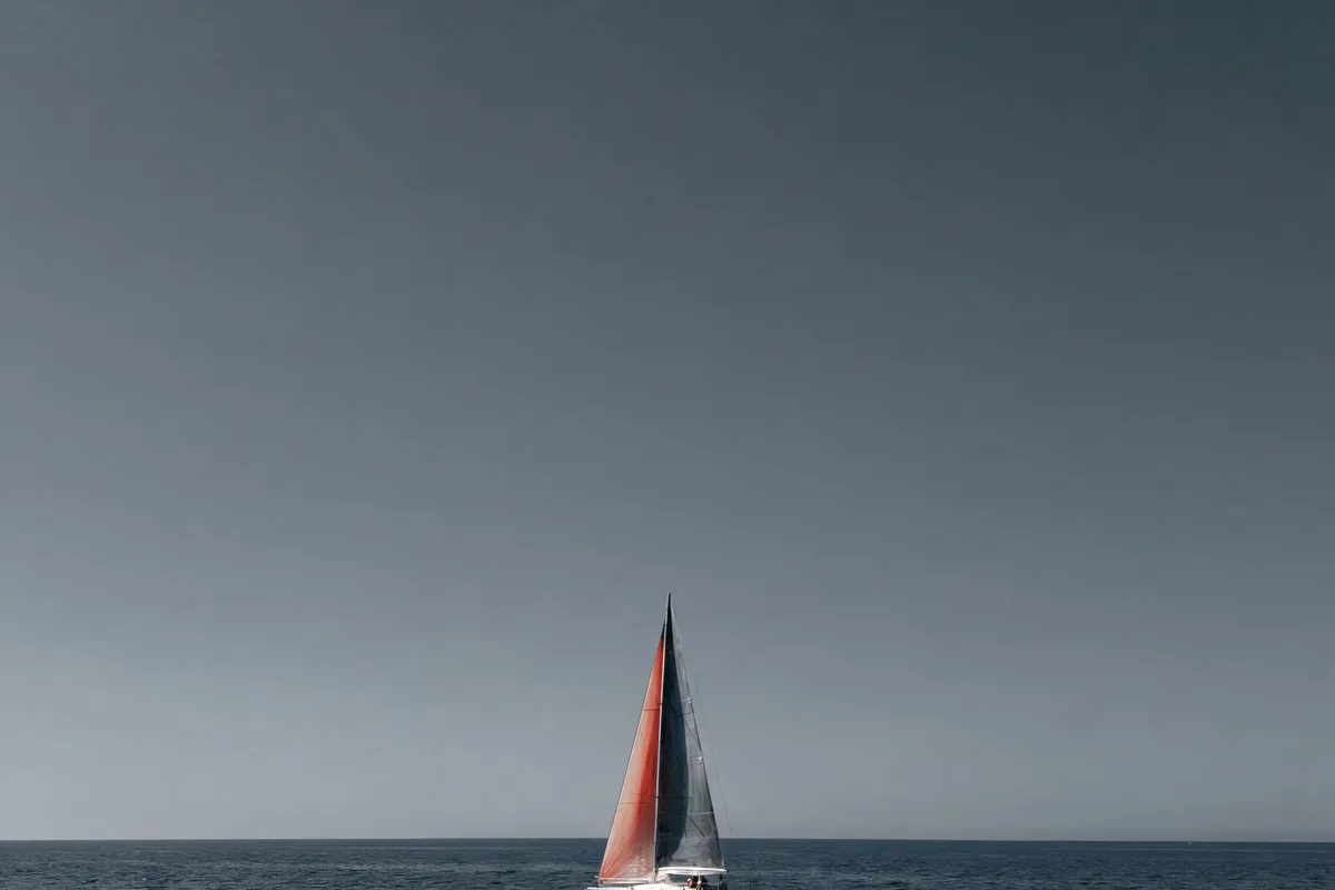 A single sailboat on a flat open sea, representing a campaign left to run steadily