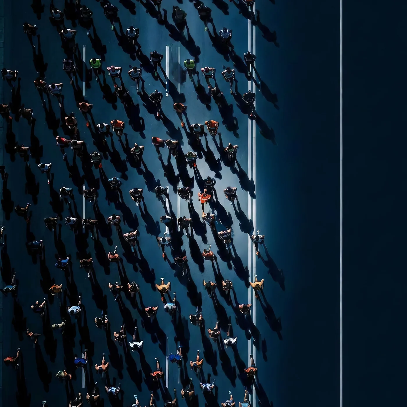 Aerial view of runners moving together along a road