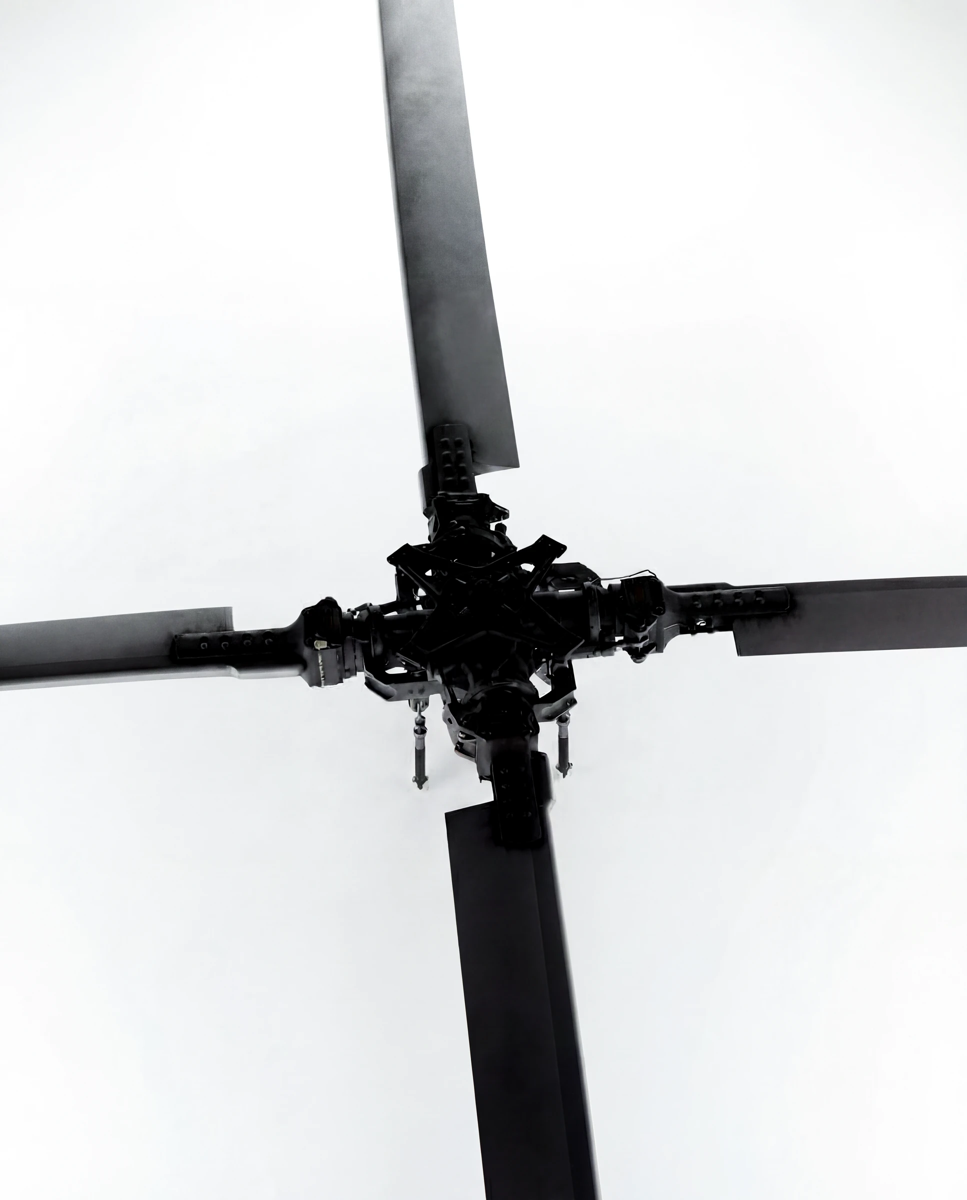 Helicopter rotor head and blades viewed from above