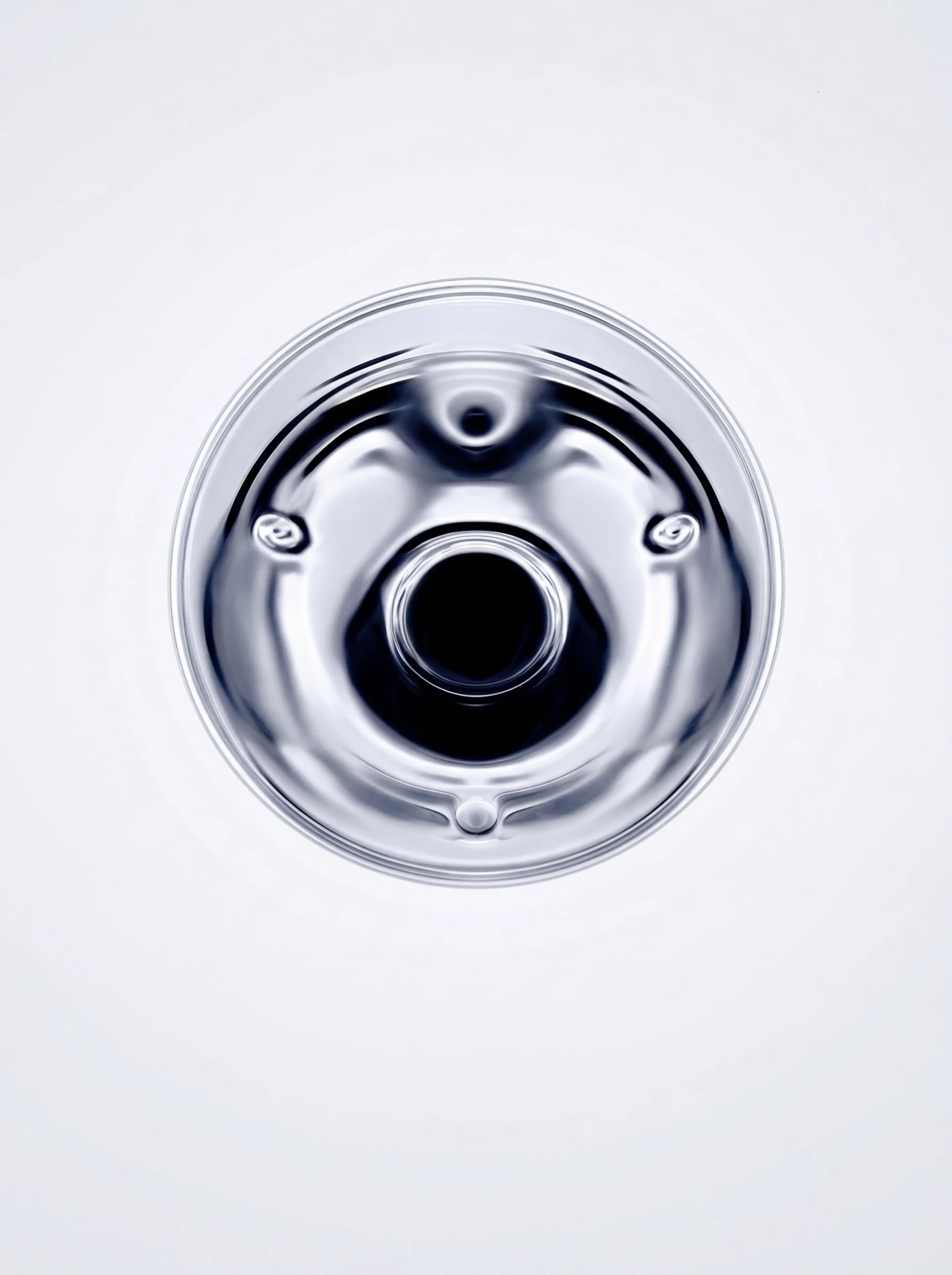 Polished chrome mechanical component viewed from above