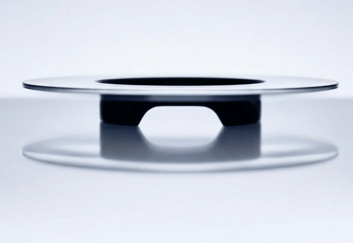A floating disc form on a pale background