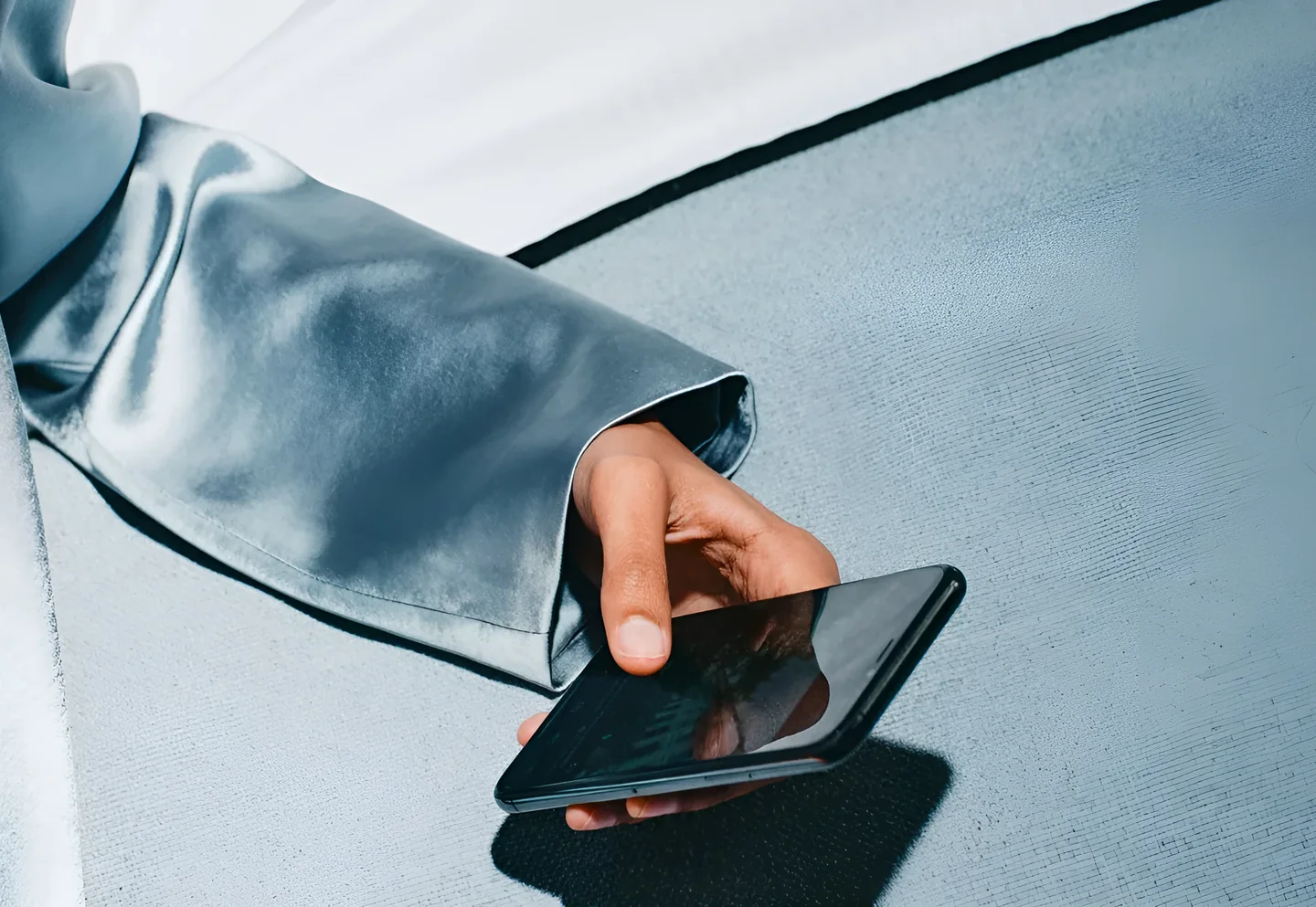 A hand resting a finger on a phone screen, representing the decision not to intervene