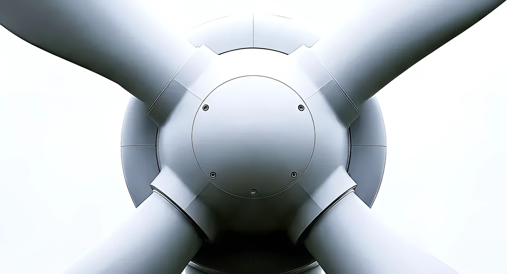 Close up of a white wind turbine hub and blades