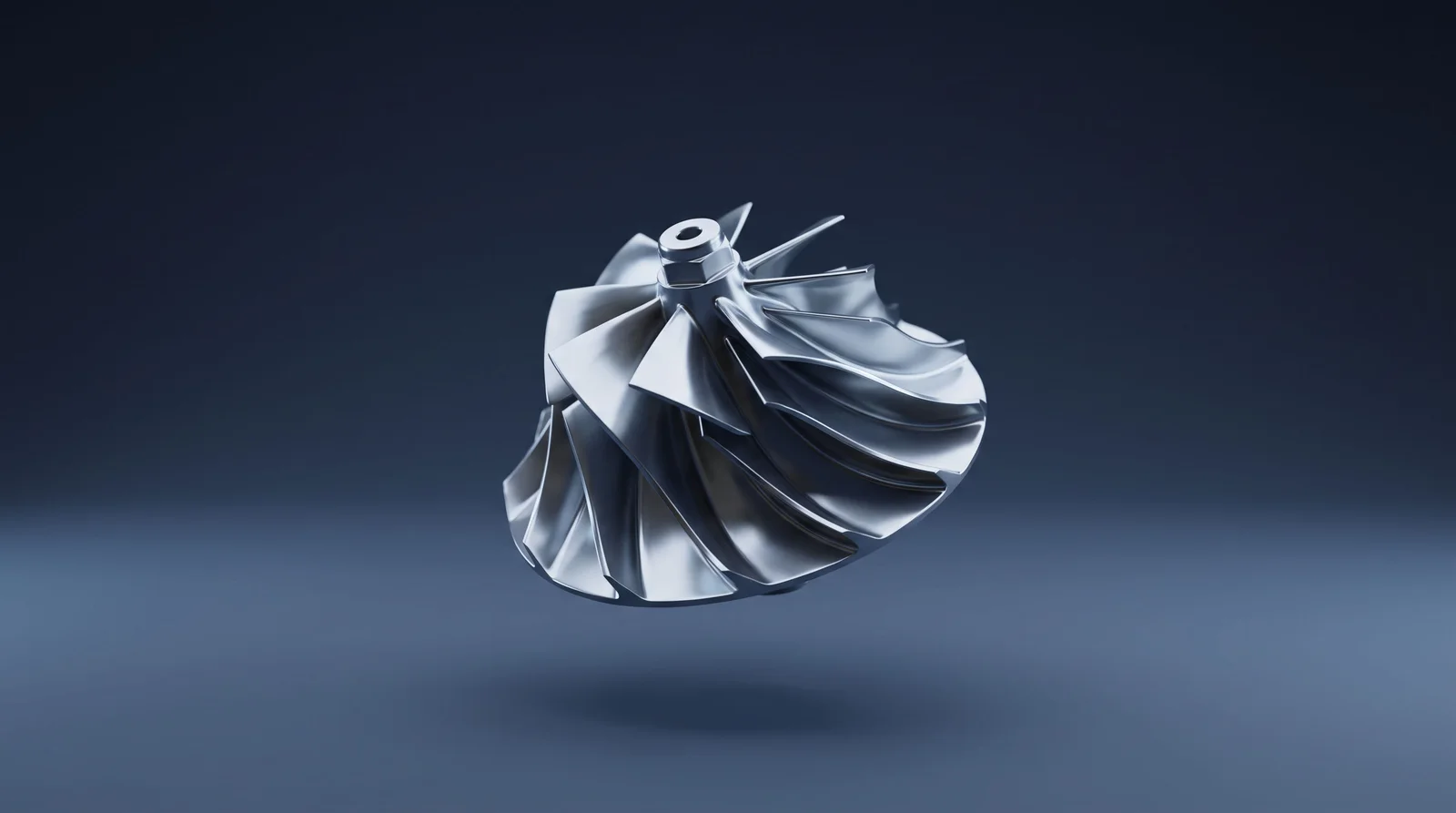 Polished steel compressor wheel floating against a deep blue background