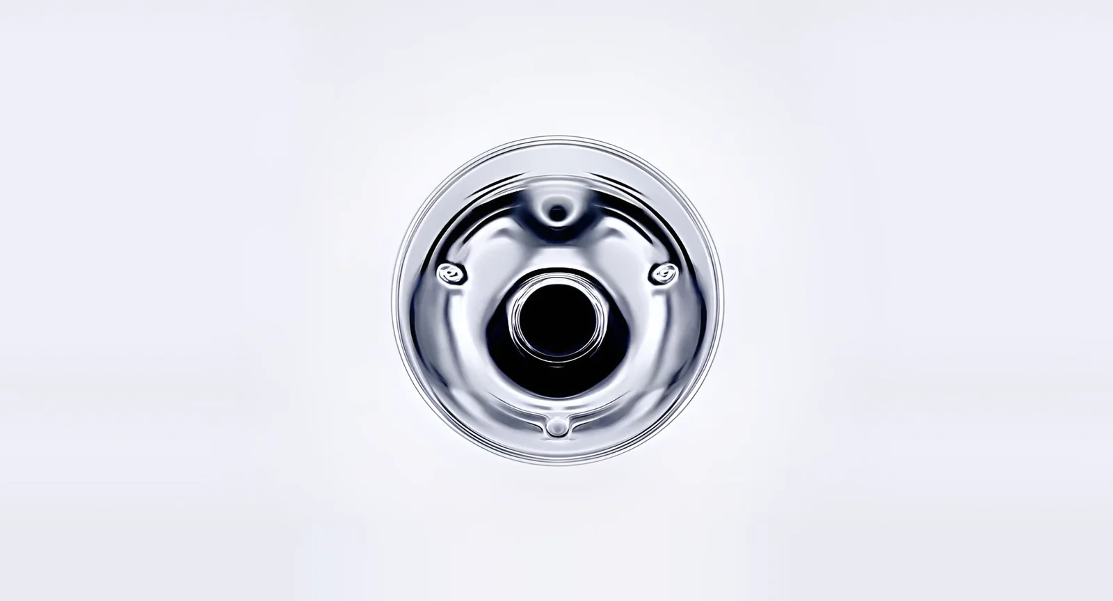 A polished chrome mechanical part on a pale background