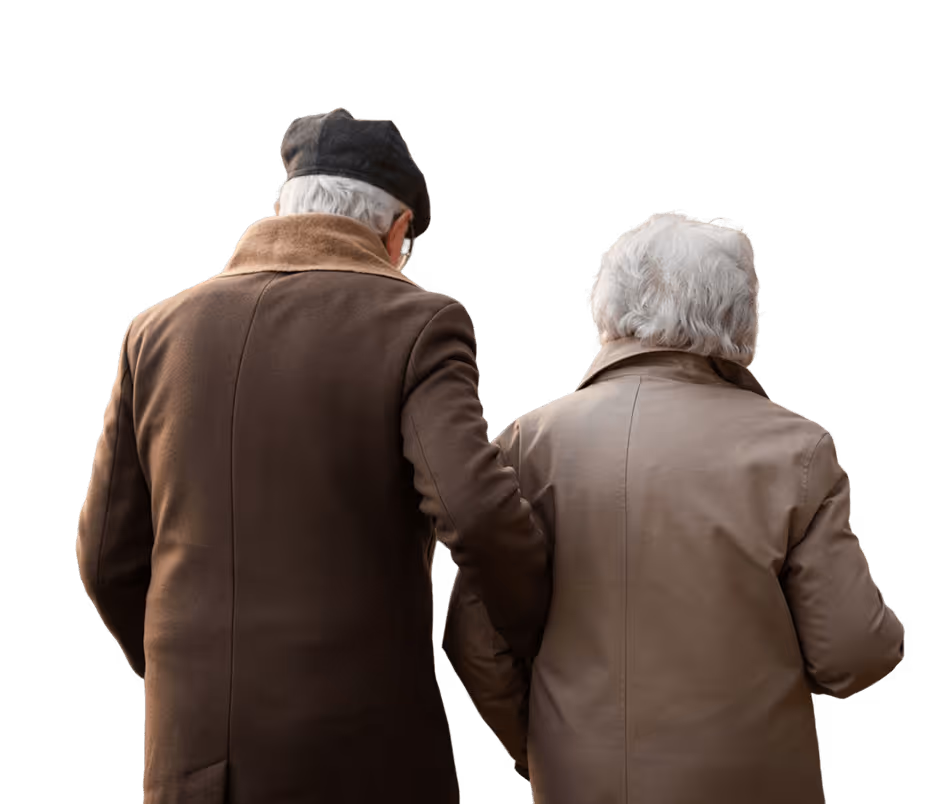 Elderly couple walking away, wearing brown coats, man in a black hat holding woman's arm.