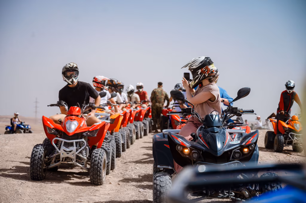Background image of people driving quad bikes