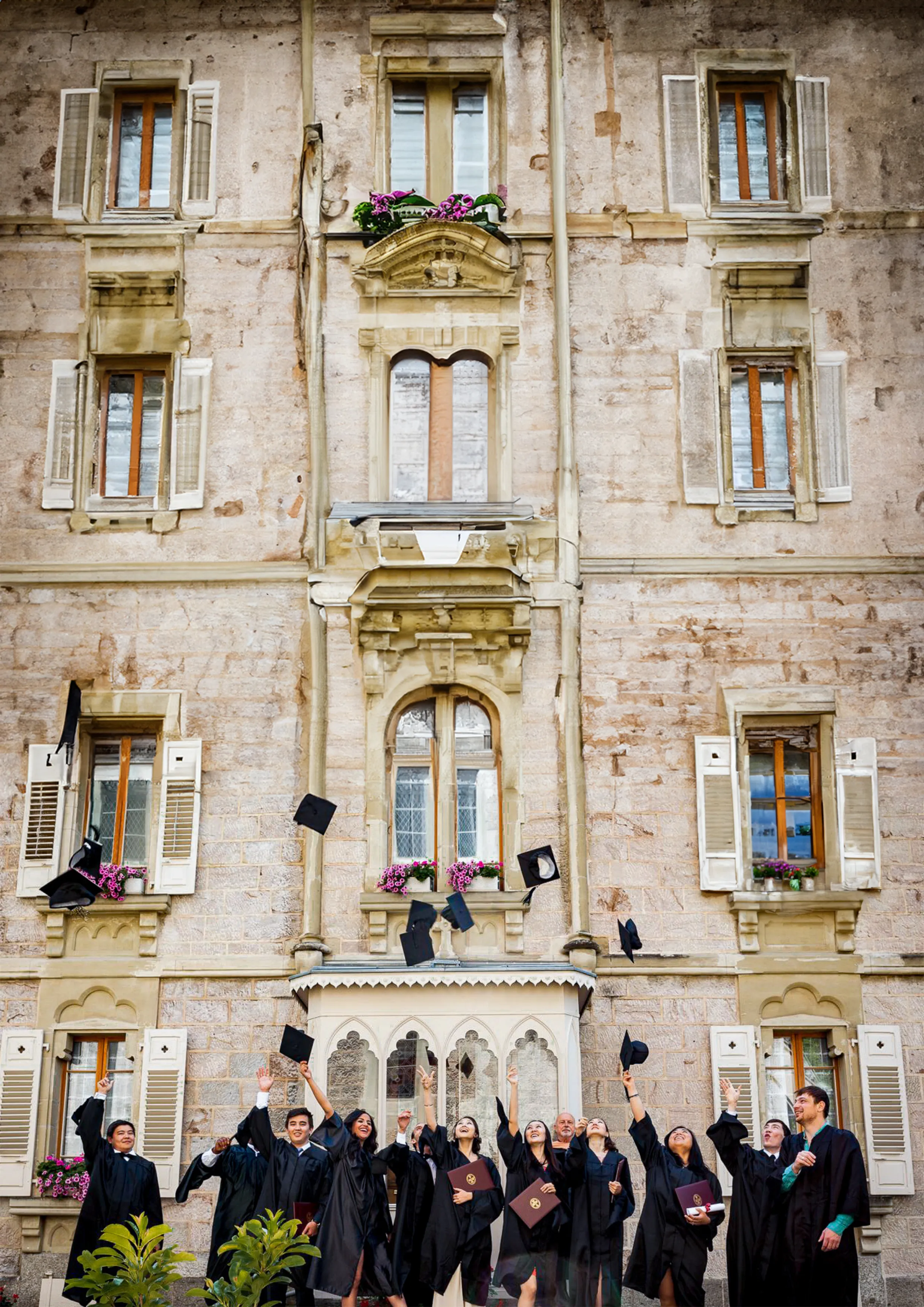 AUS graduates celebrating at commencement