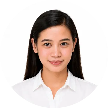 Young woman with long black hair wearing a white collared shirt against a white background.