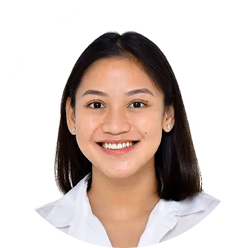 Portrait of a smiling woman with straight black hair wearing a white shirt on a white background.