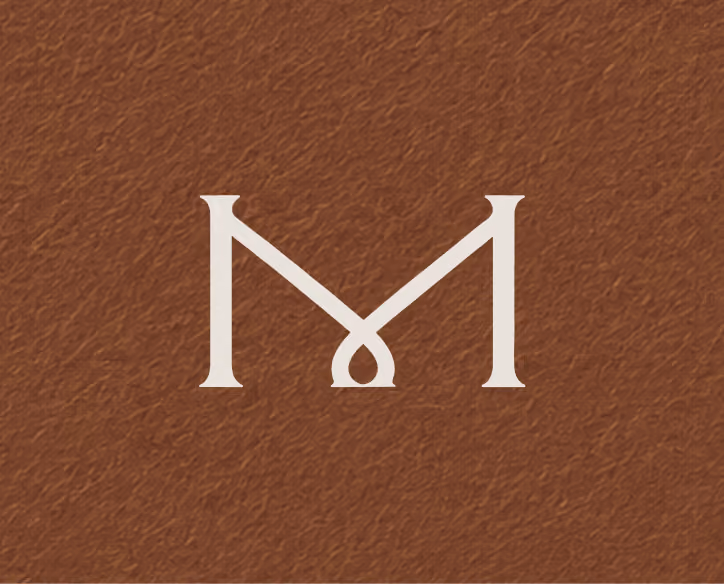 Stylized letter M logo with an elegant crossed design on a textured brown background.