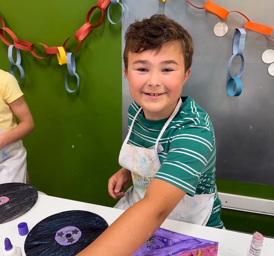 Kids at a Kidcreate summer art camp working on colorful projects