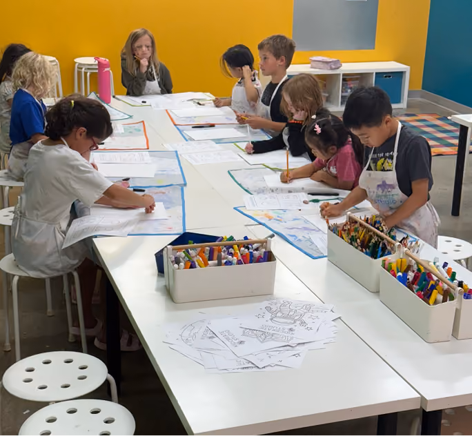 Kids making art at a community event with Kidcreate Studio