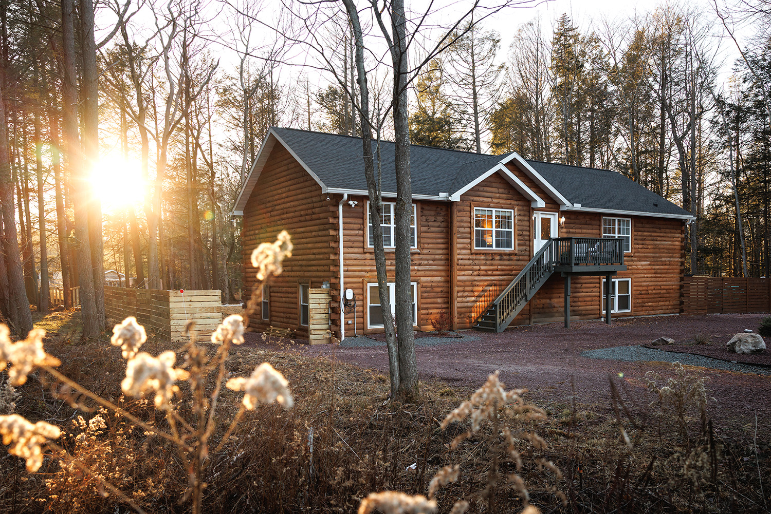 Mountain vacation home in Bethel, Maine with outdoor deck, seating area, and scenic fall foliage views