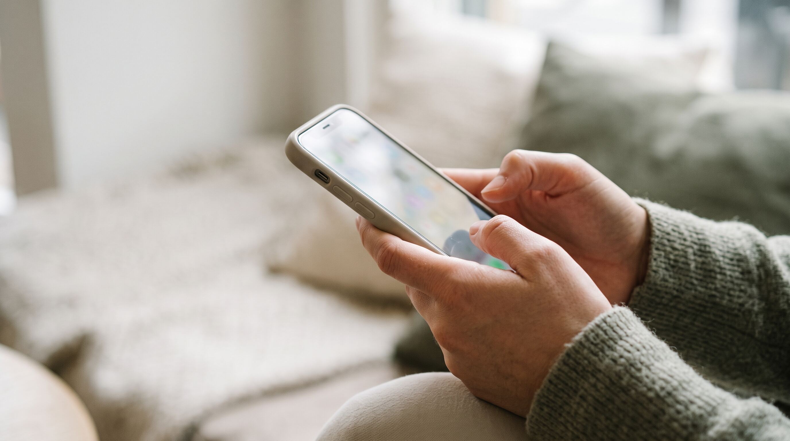 hands with a phone