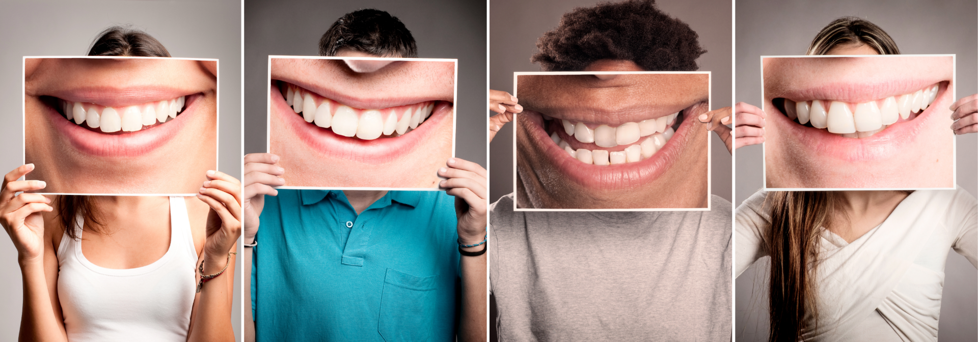 Four people holding photos of large smiles in front of their faces against a plain background.