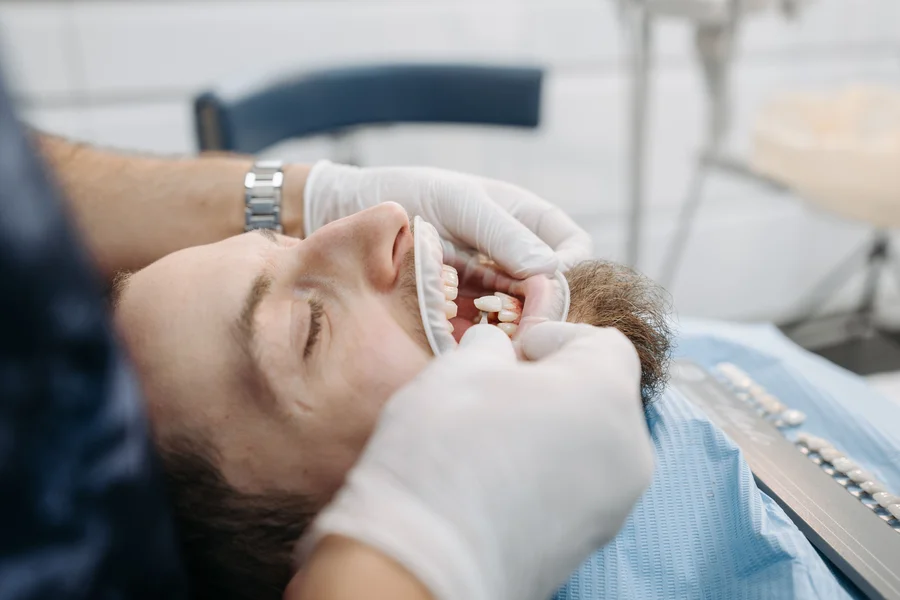 dentist-fitting-porcelain-veneer-affordable-veneers-atlanta