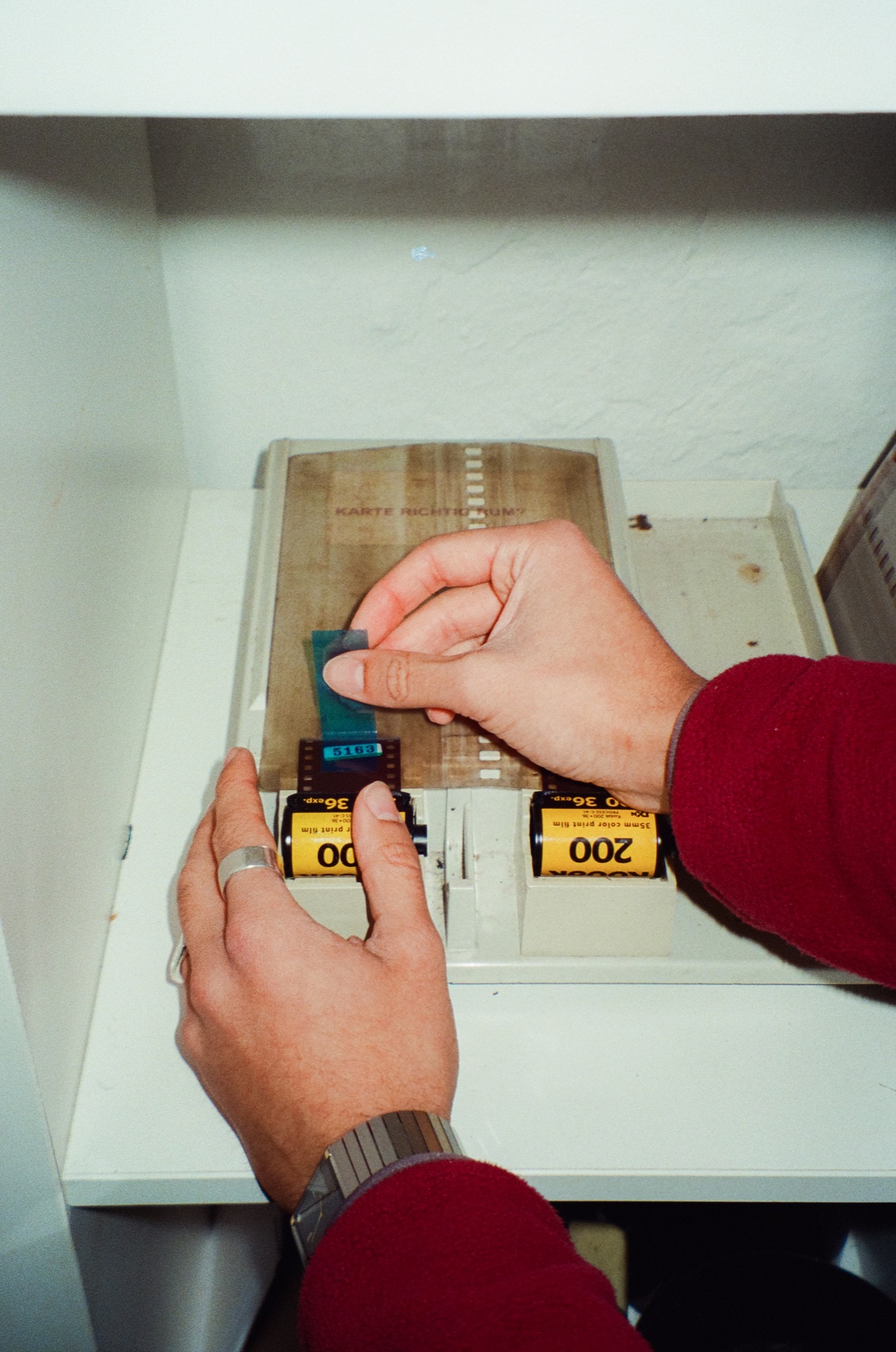 Hands preparing a roll of film at Spieker Film Lab.