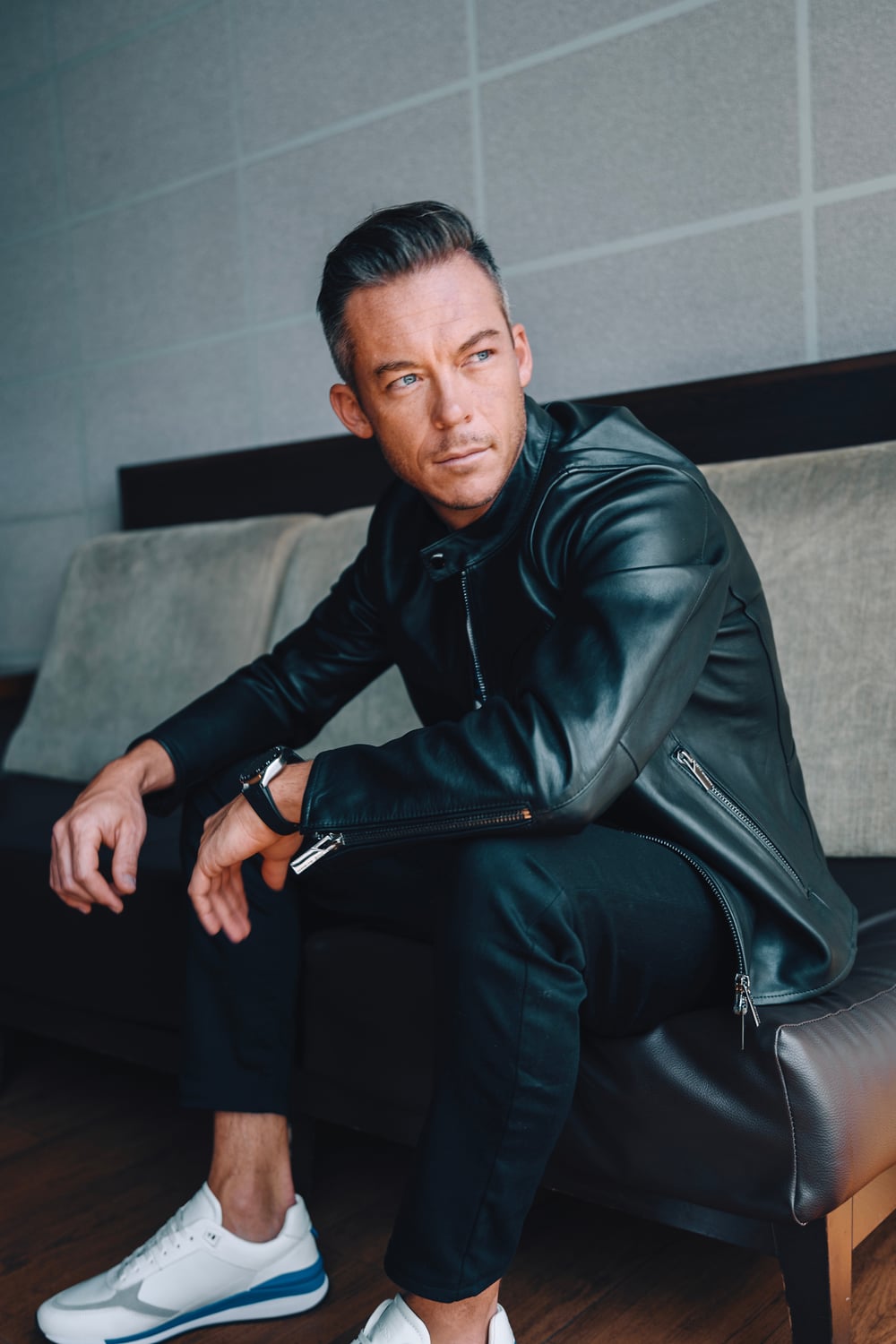 André Lotterer in a black leather look from the BOSS x Porsche collection in London