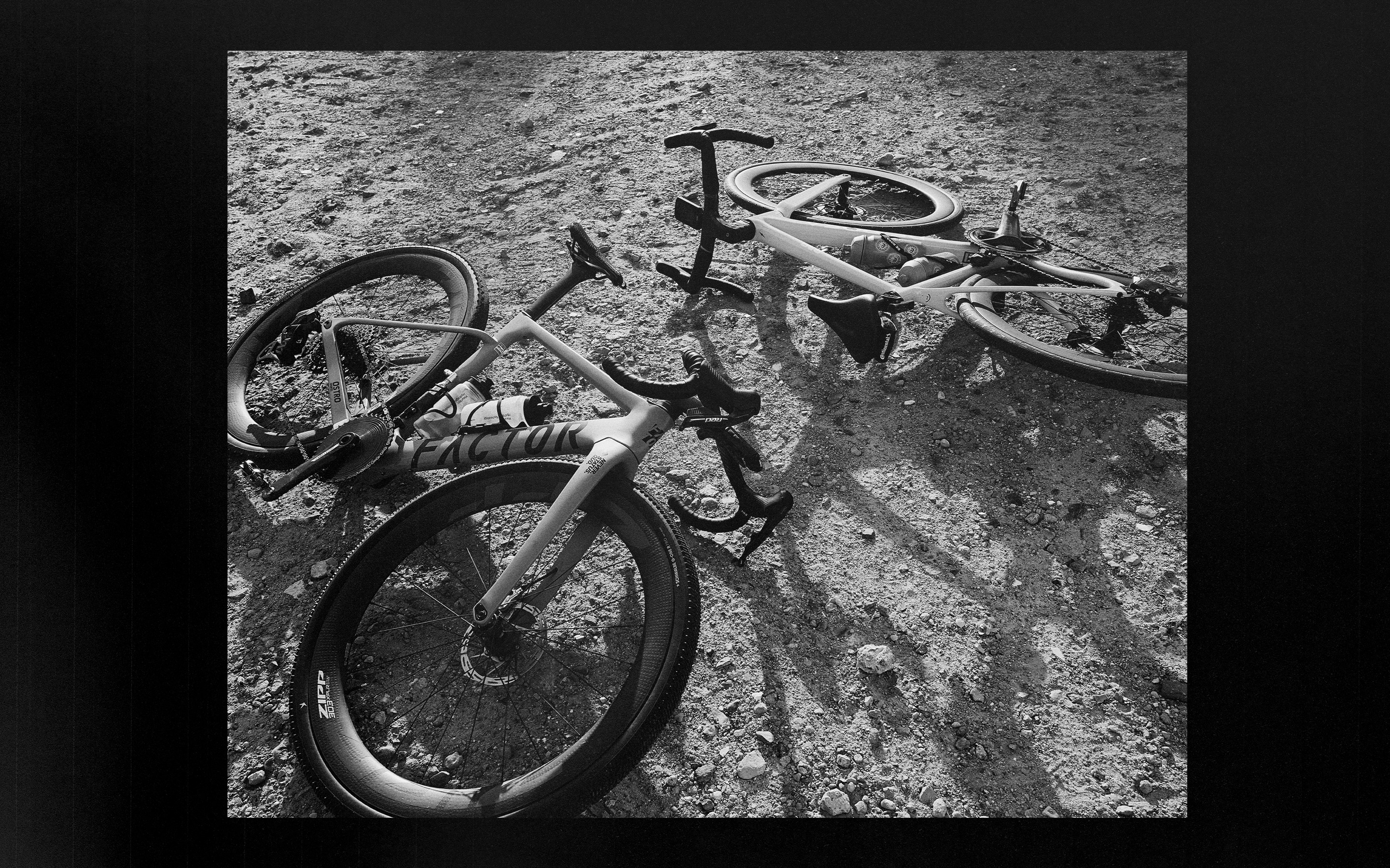 A black-and-white photograph of resting bicycles, presented as an analog editorial layout.