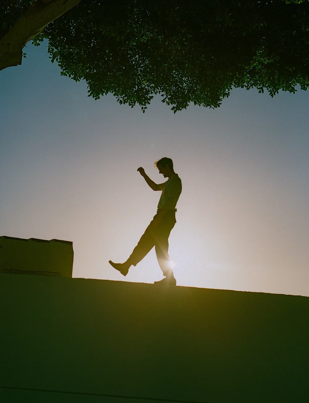 Analog menswear editorial in Mallorca, photographed by Felix Bernason — frame 8.