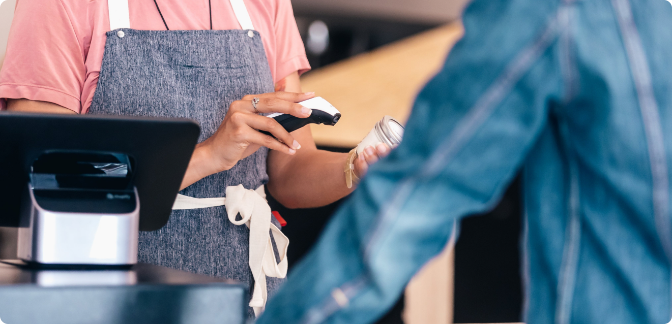 Customer paying with a card at a payment terminal