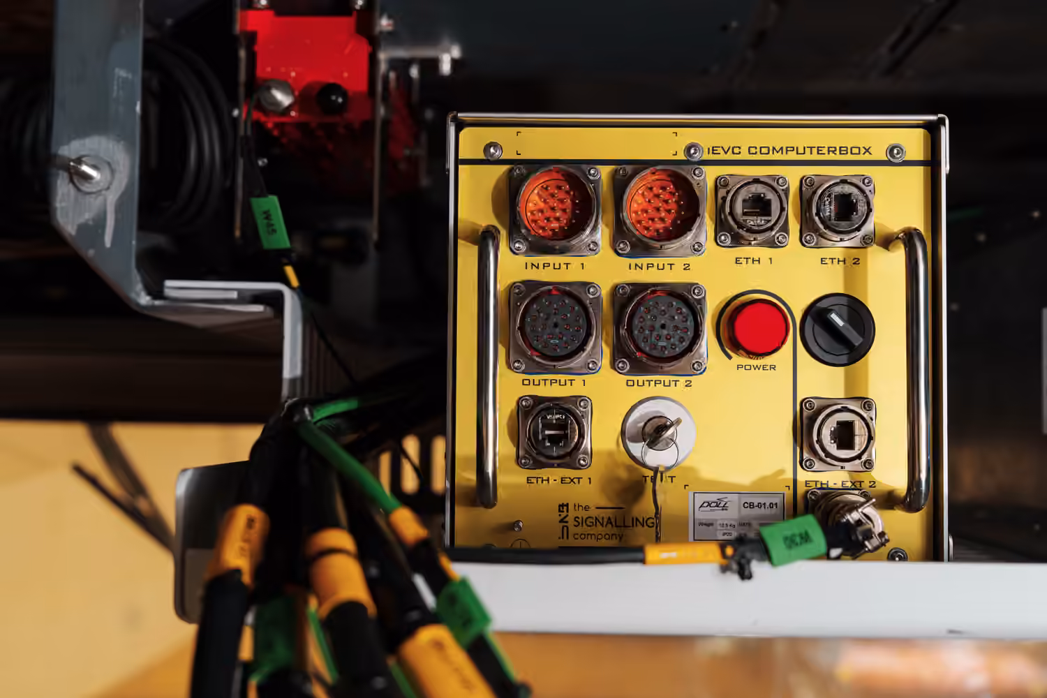 Yellow iEVC Computerbox installed and wired inside a locomotive.