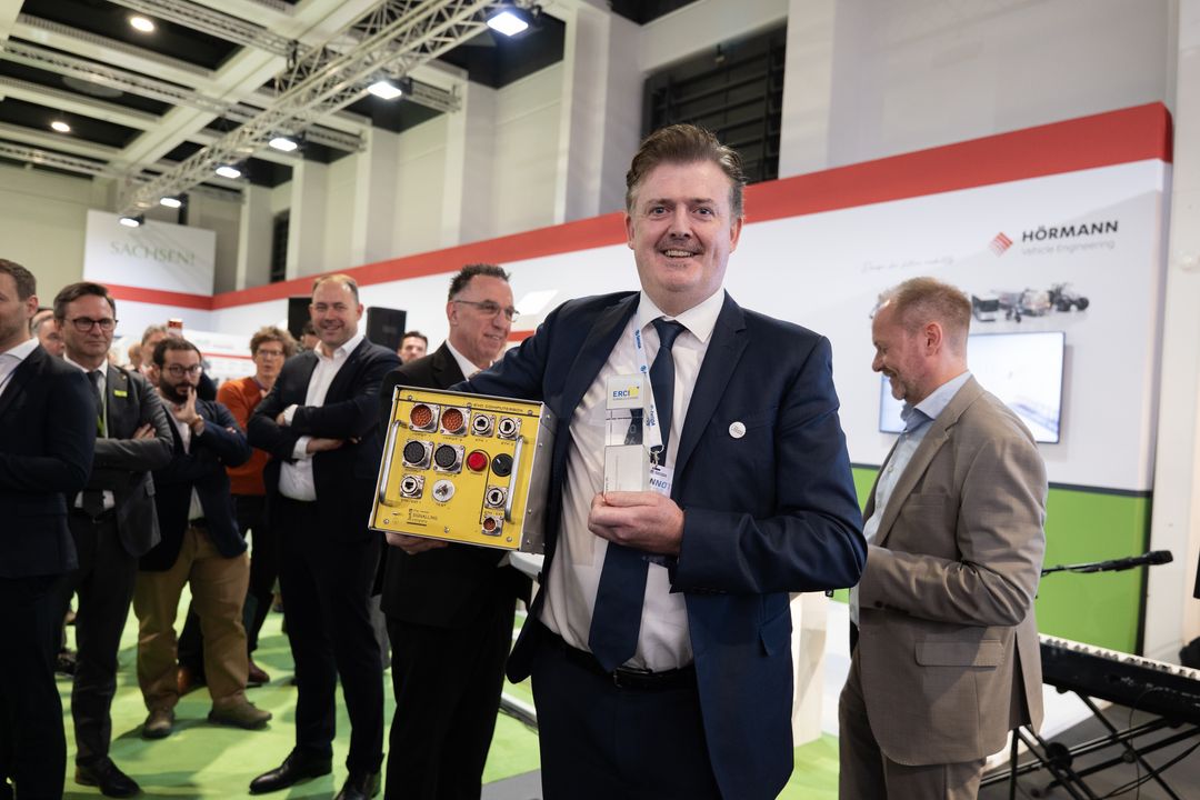 Jarlath Lally holding both the innovation and the award