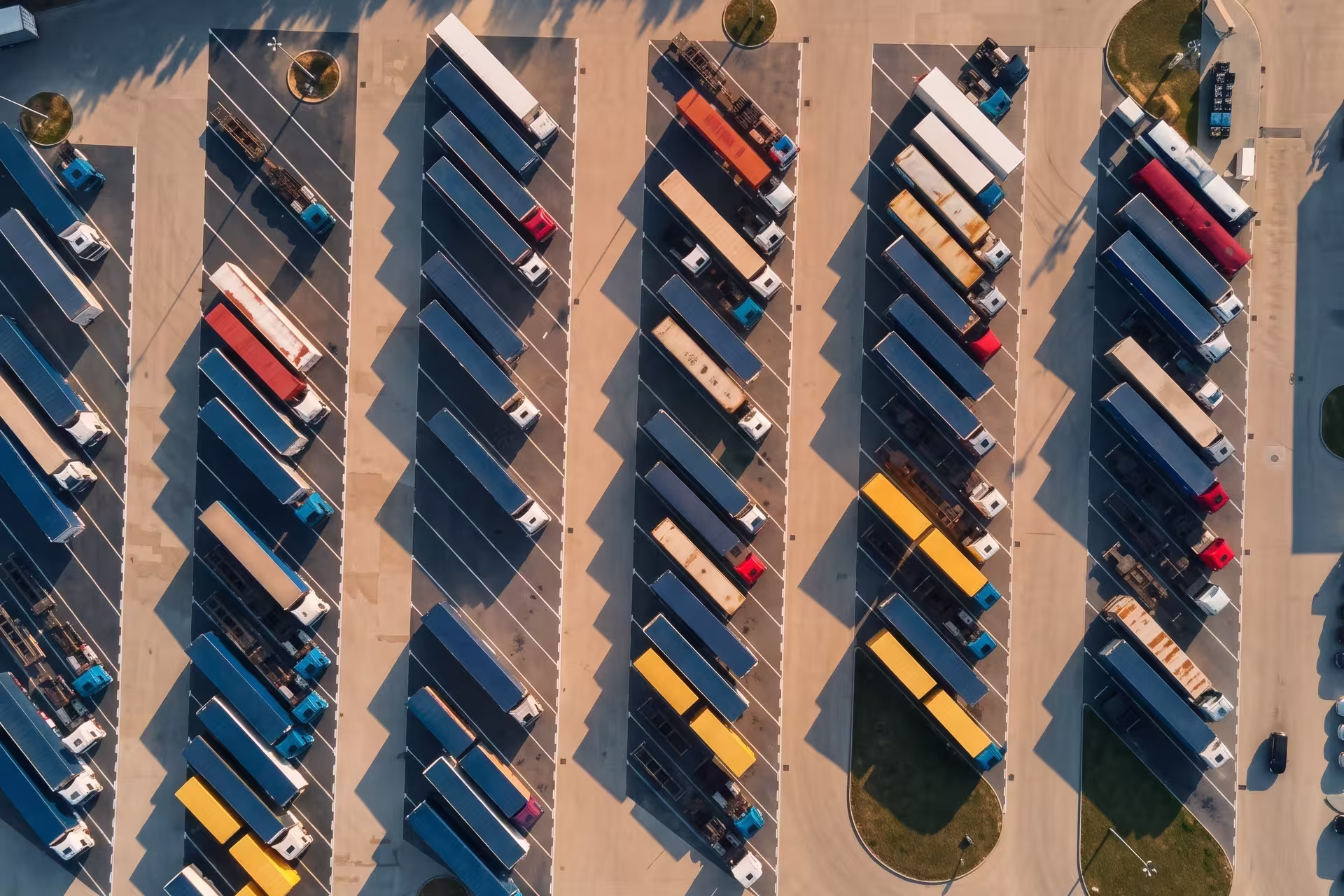 Aerial view of a large trailer storage yard with rows of parked trailers