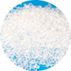 Close-up of translucent plastic pellets used for manufacturing, on a blue background.
