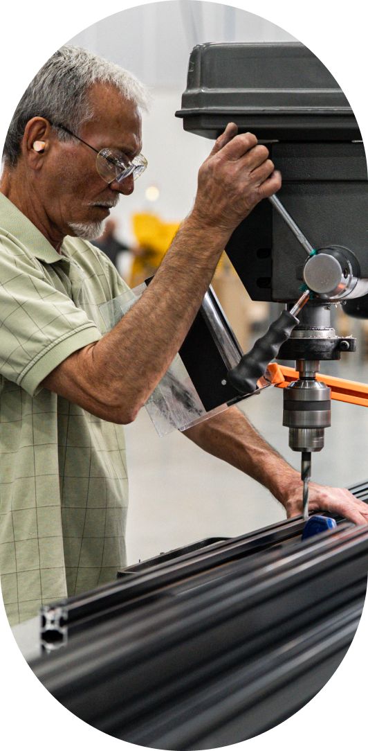 Machinist drilling SkyBridge components