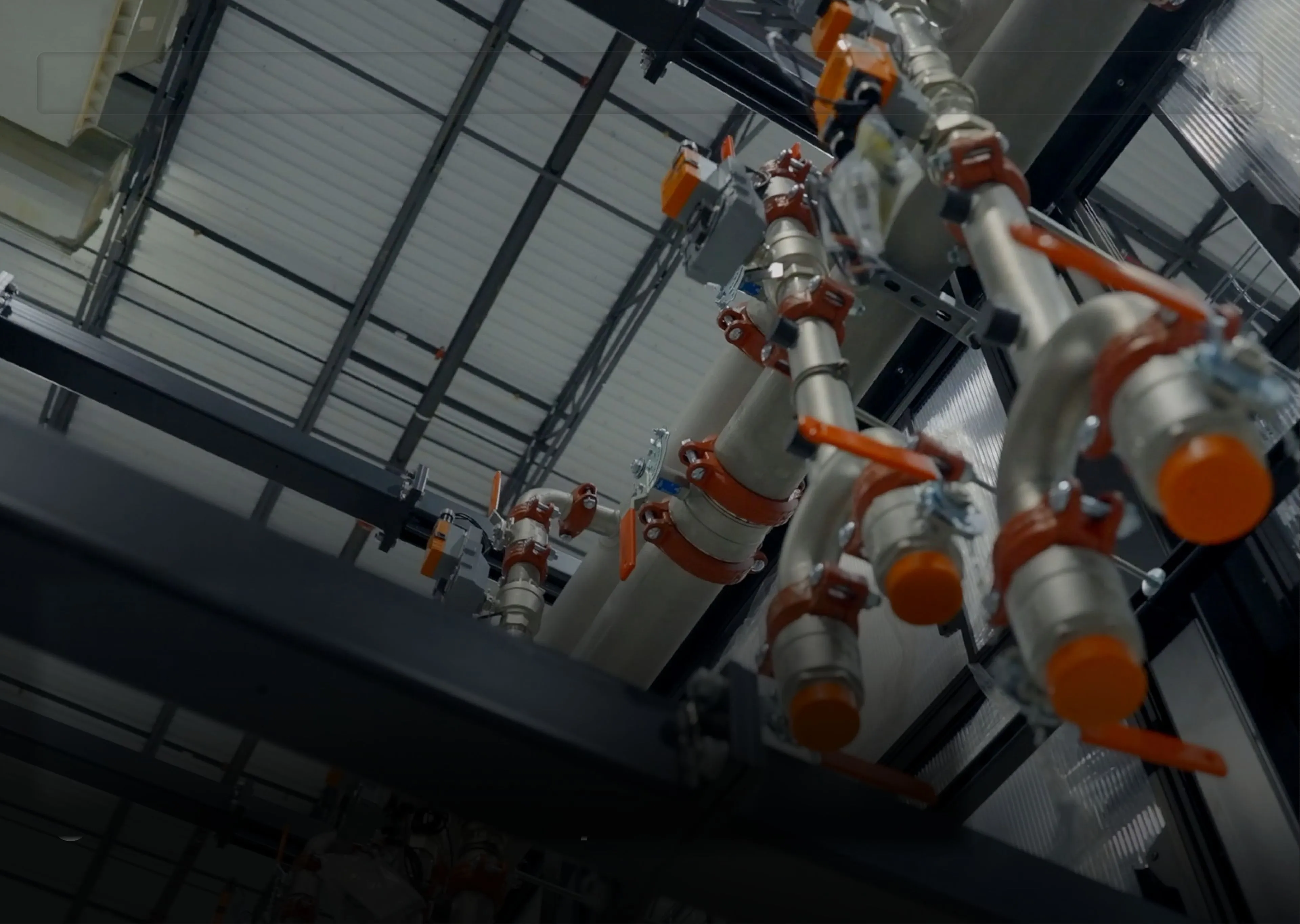 Liquid cooling manifolds installed above a data hall
