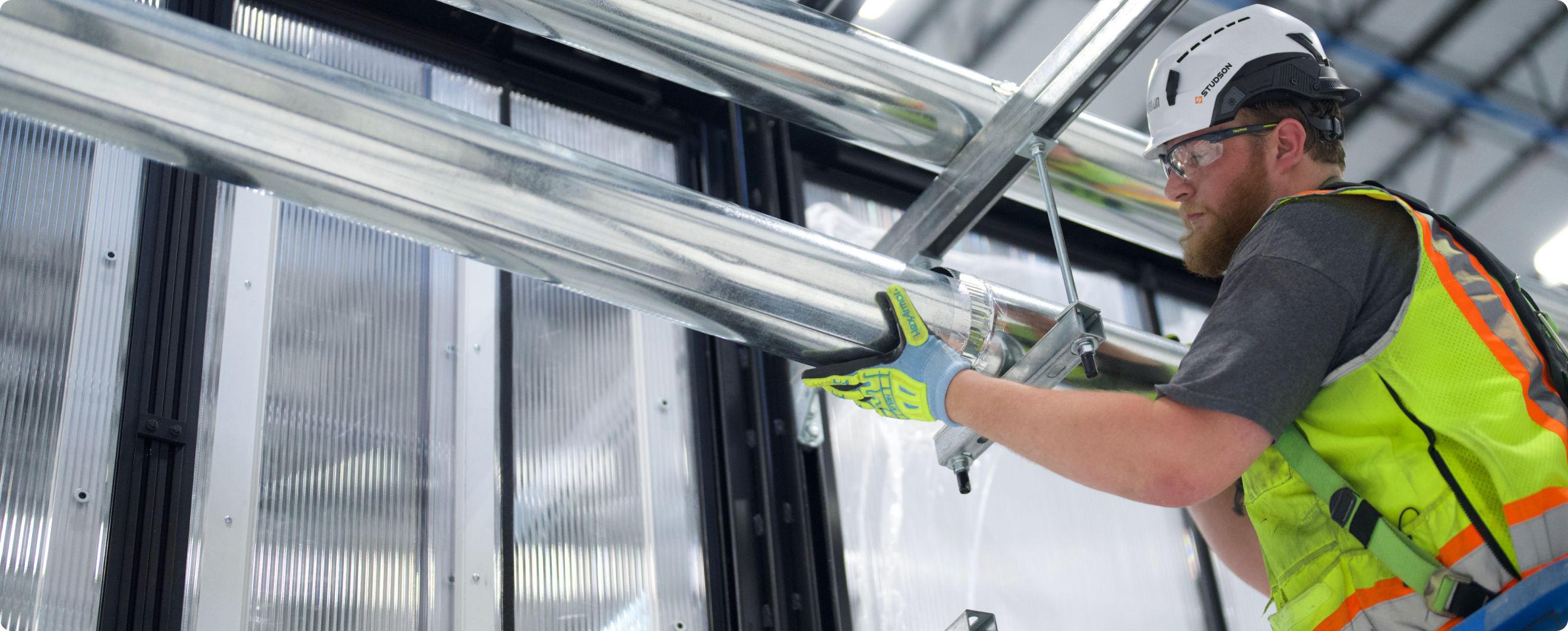 Accelevation field technician installing liquid cooling infrastructure