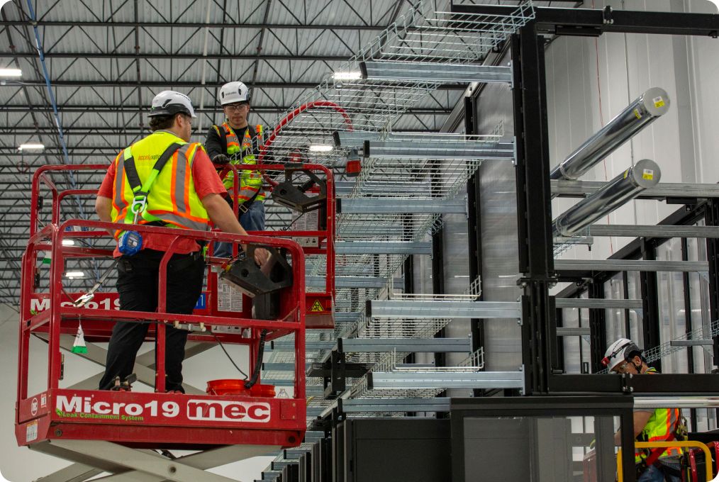 Accelevation crews installing conveyance