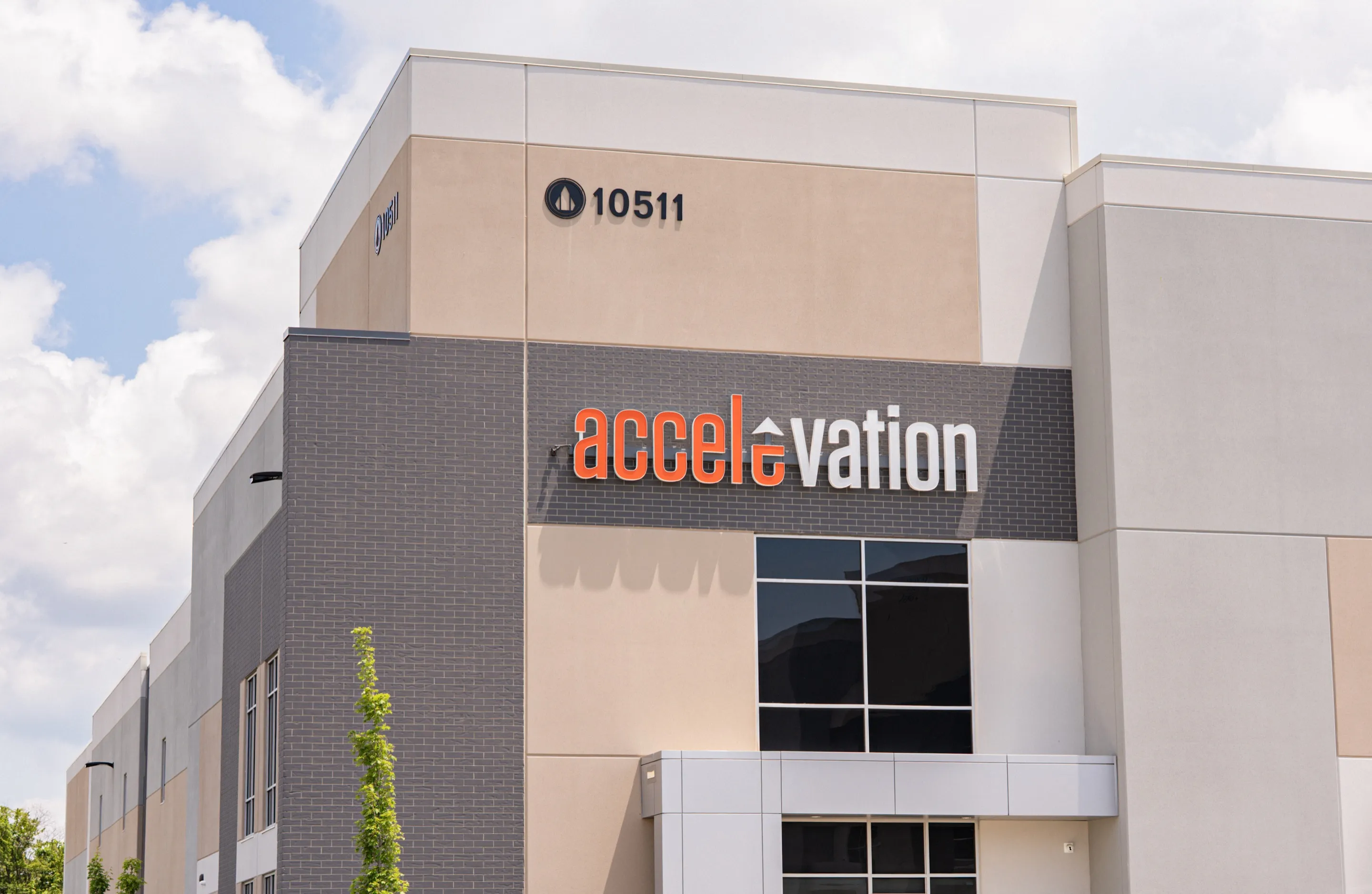Exterior of the Accelevation headquarters building with company signage