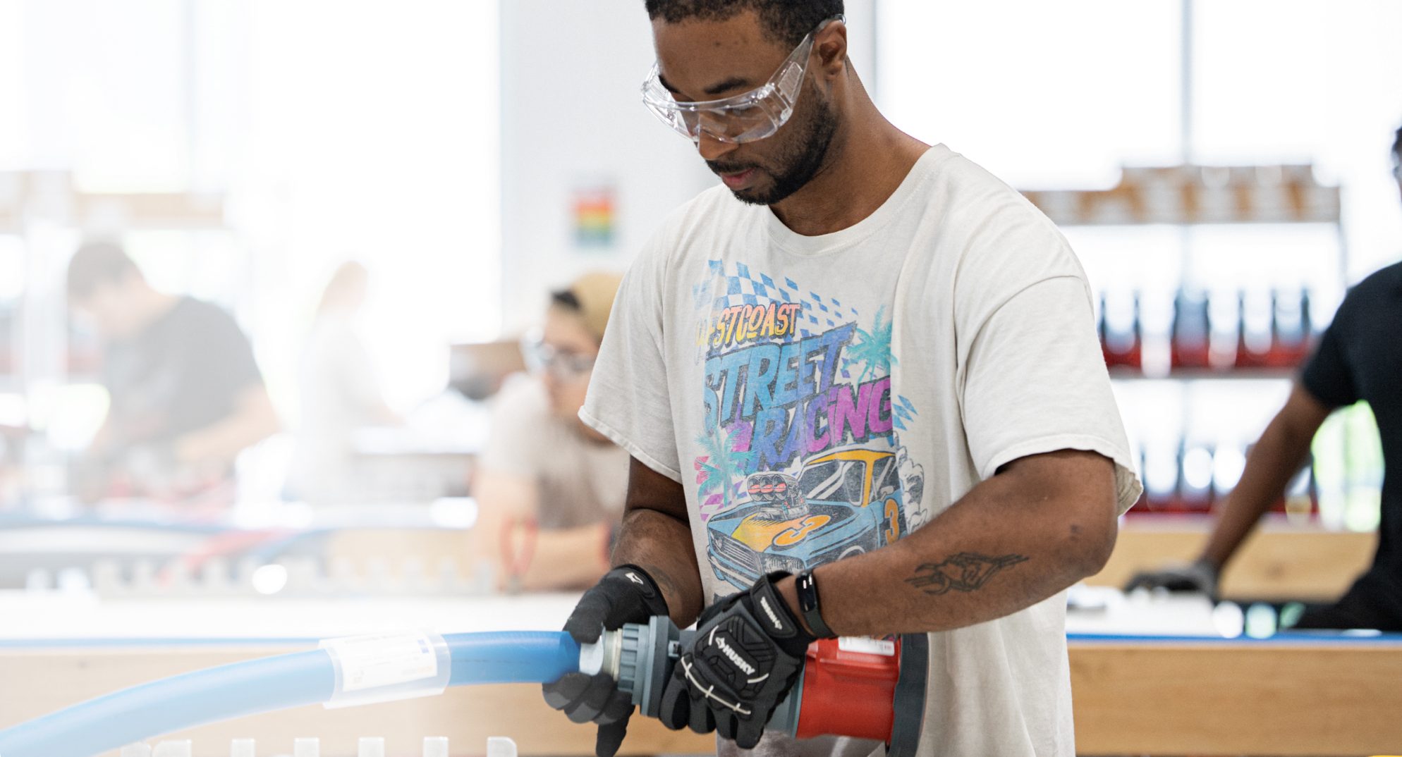 Technician assembling a branch circuit whip on the production floor