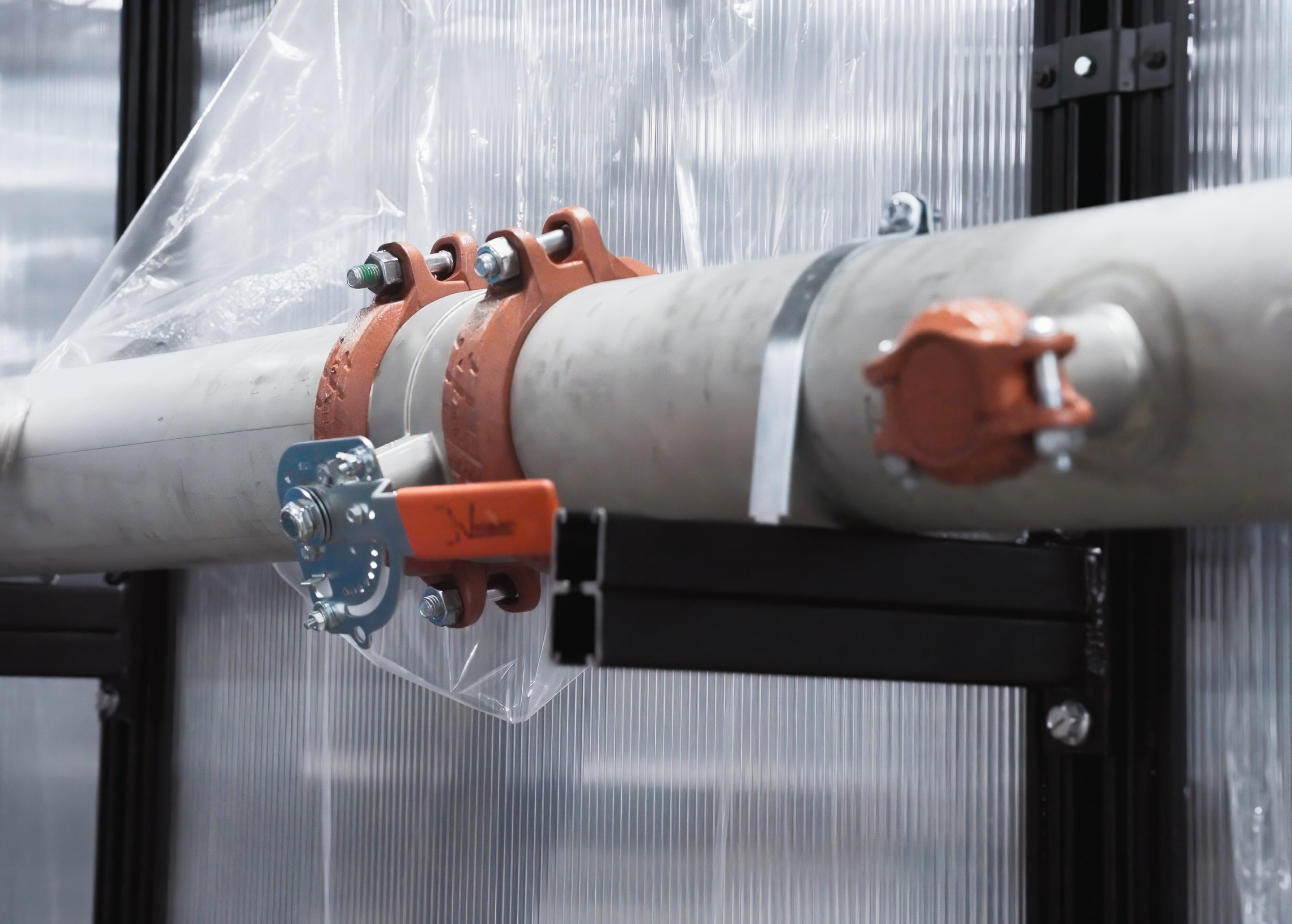 Liquid cooling piping inside a containment aisle