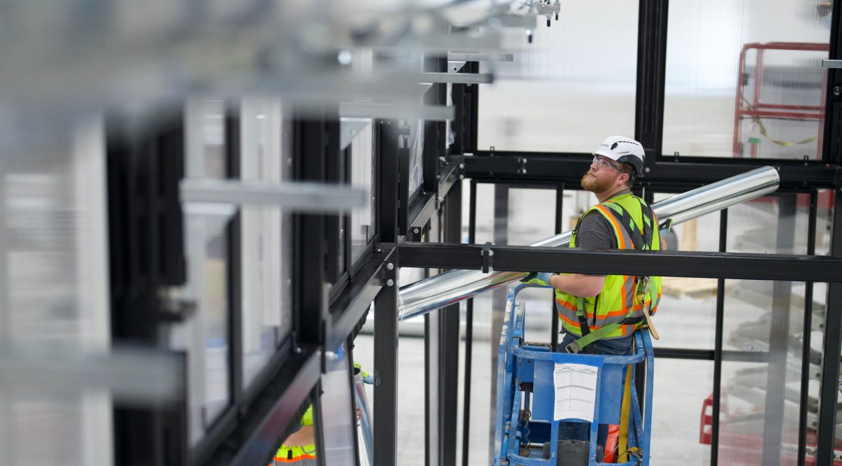 Accelevation technician installing liquid cooling infrastructure