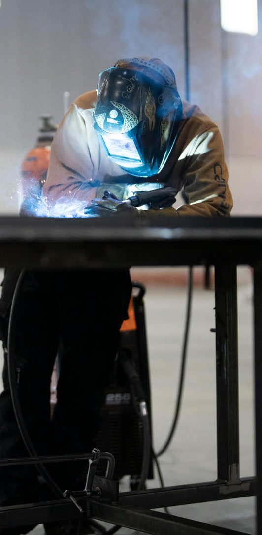 Welder fabricating a SkyBridge assembly