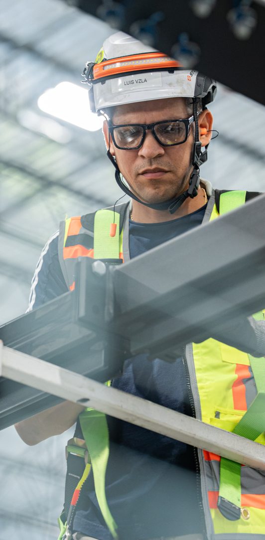 Field technician inspecting installed structure