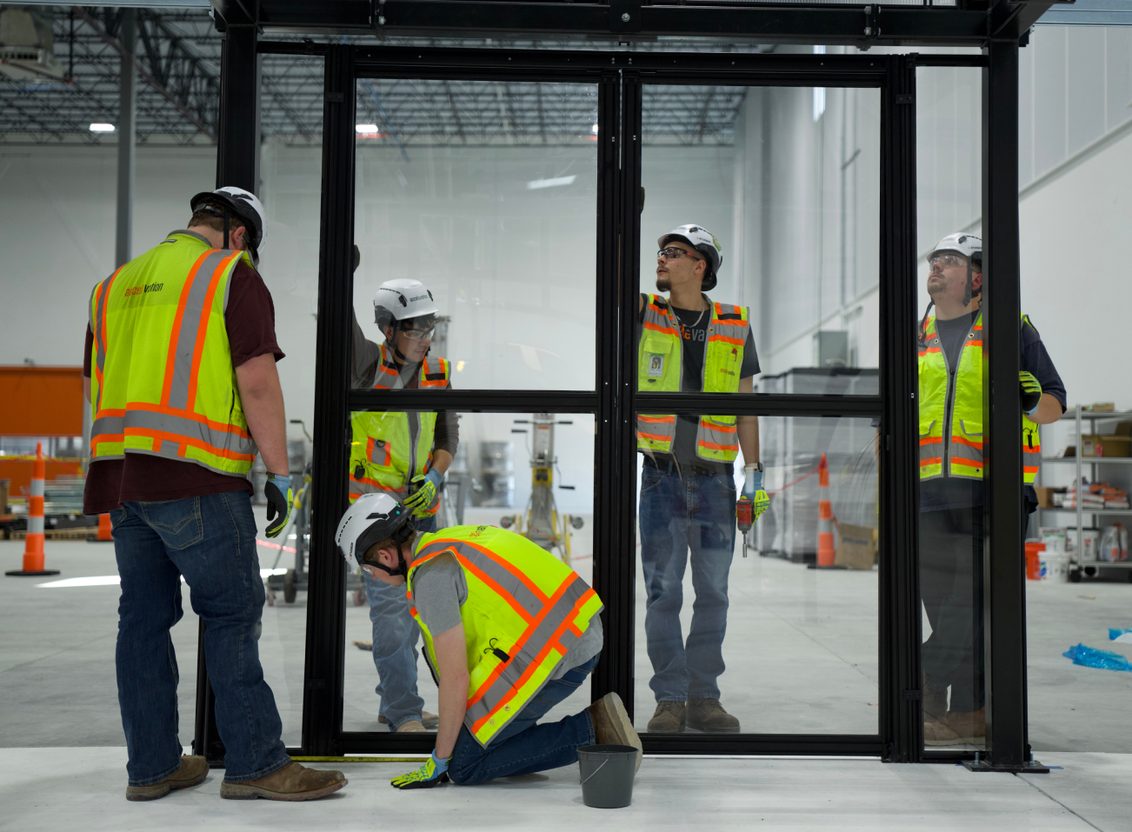 Installation technicians preparing equipment on site