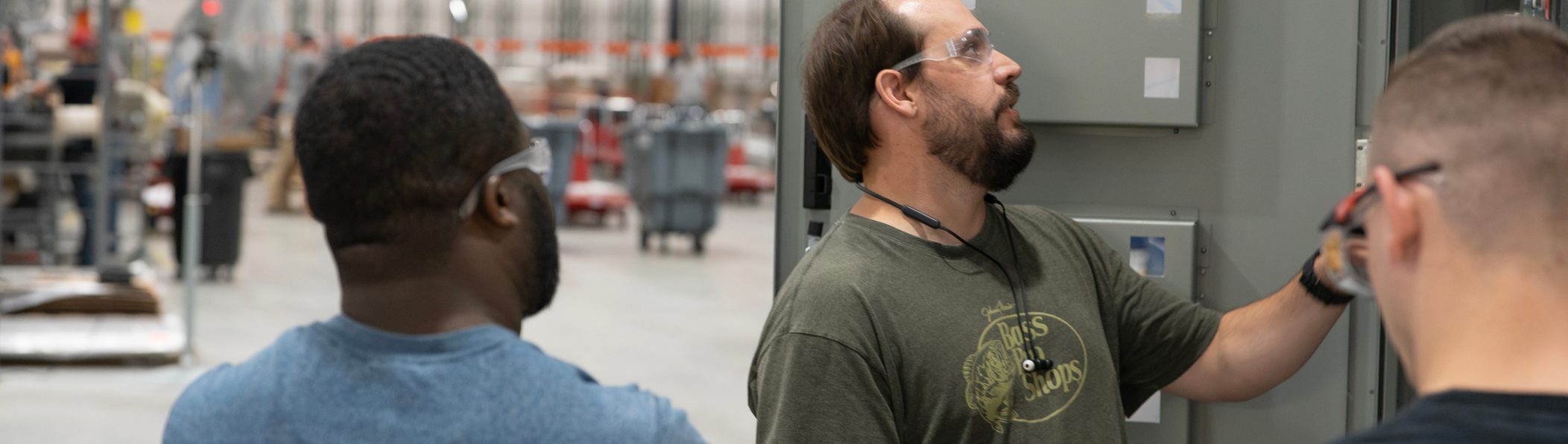 Accelevation team reviewing work at an electrical panel