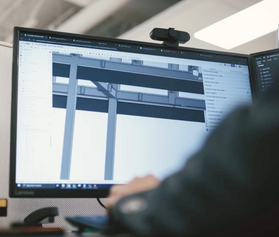 Engineer reviewing a 3-D model of a steel frame