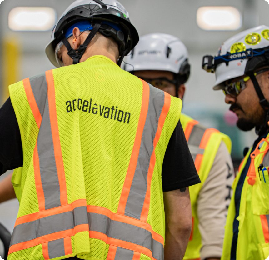 Accelevation field crew on site in high-visibility gear