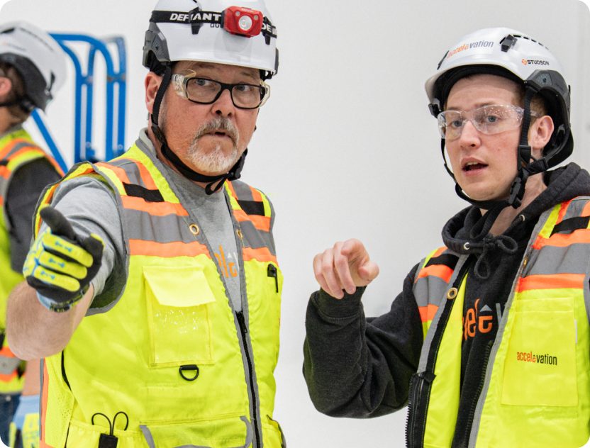 Accelevation field technicians reviewing a preventive maintenance inspection