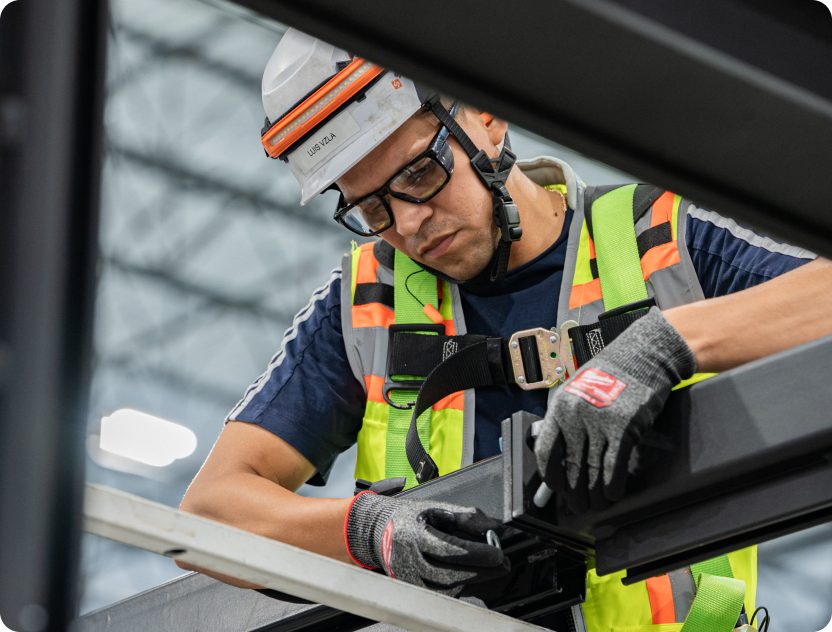 Accelevation electrician performing corrective maintenance on installed infrastructure